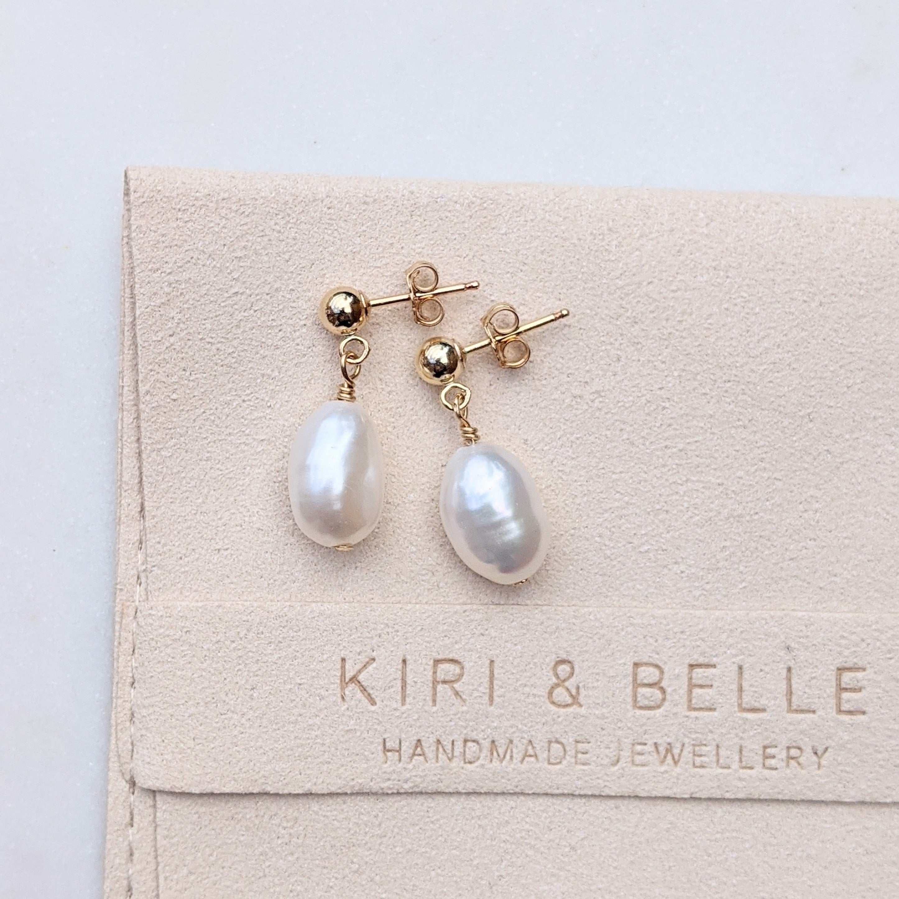 Single ball hot sale drop earrings